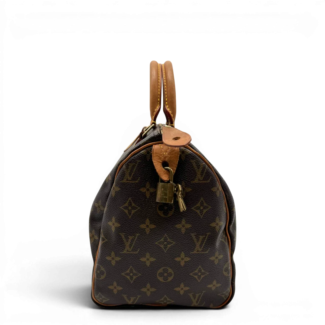https://cdn.shopify.com/s/files/1/0564/9376/8855/files/Louis_Vuitton_Handtasche_Speedy_30_monogram_braun_vintage_LV2108.webp?v=1779963630