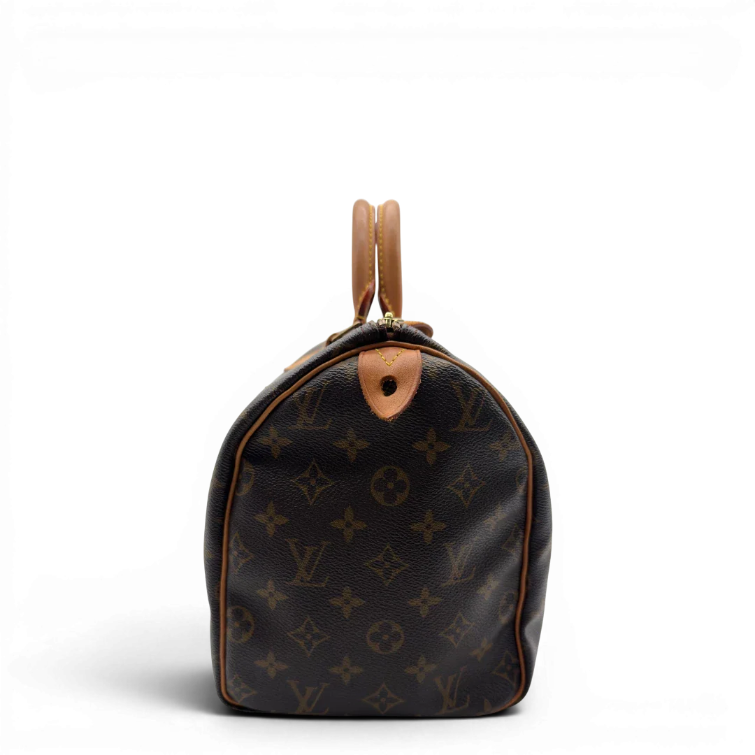 https://cdn.shopify.com/s/files/1/0564/9376/8855/files/Louis_Vuitton_Handtasche_Speedy_30_monogram_braun_vintage_LV7390.webp?v=1778667068