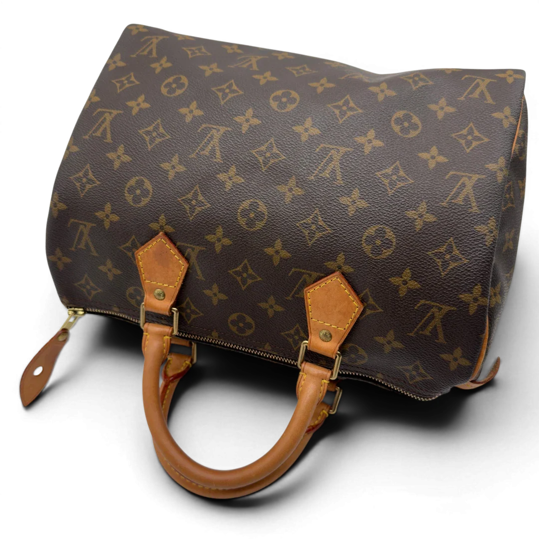 https://cdn.shopify.com/s/files/1/0564/9376/8855/files/Louis_Vuitton_Handtasche_Speedy_30_monogram_braun_vintage_LV7396.webp?v=1778667069