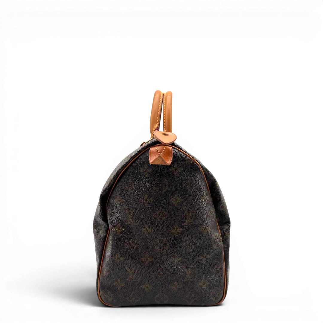 https://cdn.shopify.com/s/files/1/0564/9376/8855/files/Louis_Vuitton_Handtasche_Speedy_35_monogram_braun_vintage_LV1708.webp?v=1779408581