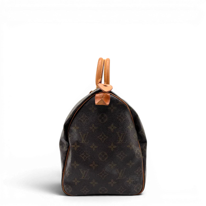 https://cdn.shopify.com/s/files/1/0564/9376/8855/files/Louis_Vuitton_Handtasche_Speedy_35_monogram_braun_vintage_LV1708.webp?v=1779408581