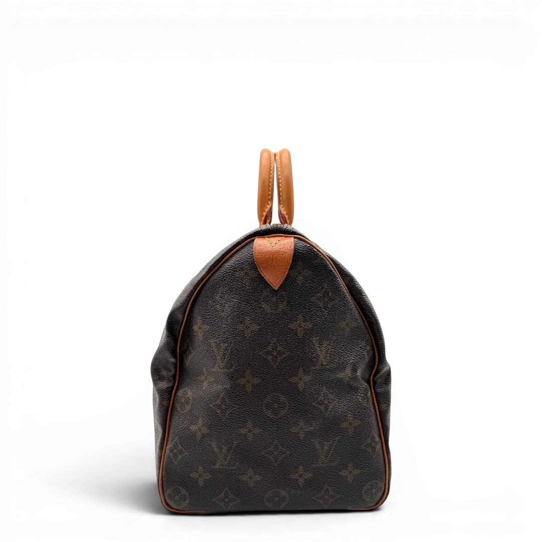 https://cdn.shopify.com/s/files/1/0564/9376/8855/files/Louis_Vuitton_Handtasche_Speedy_35_monogram_braun_vintage_LV1710.webp?v=1779408579