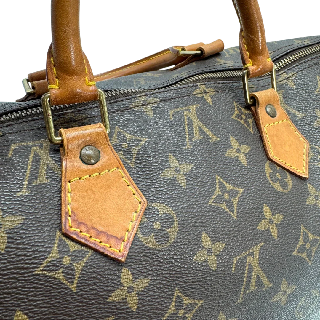 https://cdn.shopify.com/s/files/1/0564/9376/8855/files/Louis_Vuitton_Handtasche_Speedy_40_monogram_braun_vintage_LV2274.webp?v=1779969023