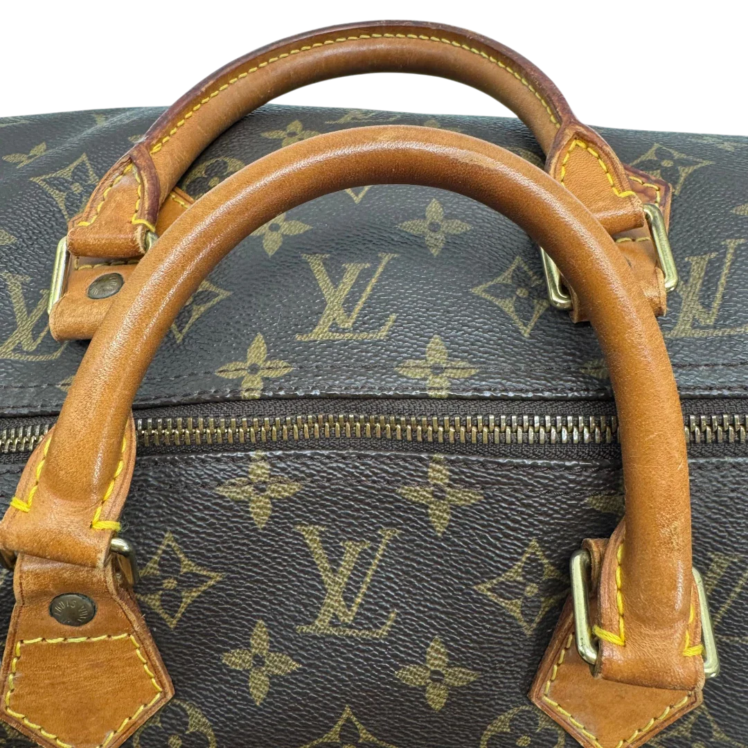https://cdn.shopify.com/s/files/1/0564/9376/8855/files/Louis_Vuitton_Handtasche_Speedy_40_monogram_braun_vintage_LV2275.webp?v=1779969023