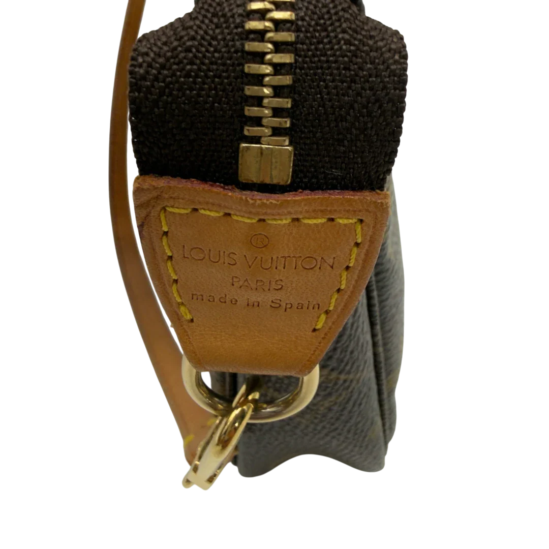 https://cdn.shopify.com/s/files/1/0564/9376/8855/files/Louis_Vuitton_Pochette_Accessoires_monogram_braun_vintage_LV7182.webp?v=1778681552