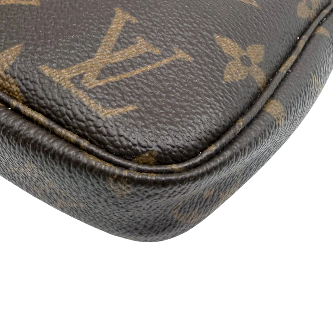 https://cdn.shopify.com/s/files/1/0564/9376/8855/files/Louis_Vuitton_Pochette_Accessoires_monogram_braun_vintage_LV8530.webp?v=1781108265