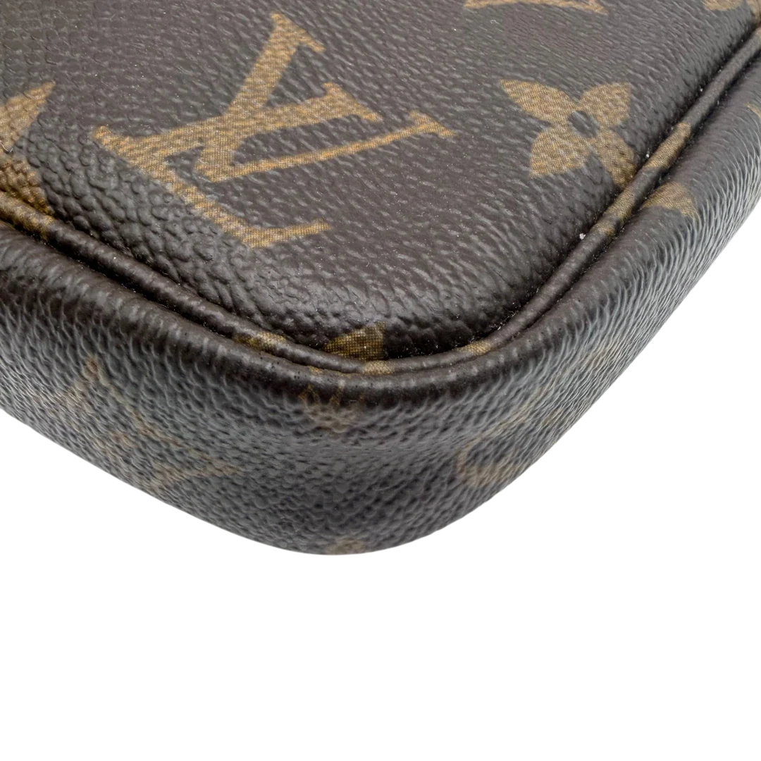 https://cdn.shopify.com/s/files/1/0564/9376/8855/files/Louis_Vuitton_Pochette_Accessoires_monogram_braun_vintage_LV8532.webp?v=1781108265
