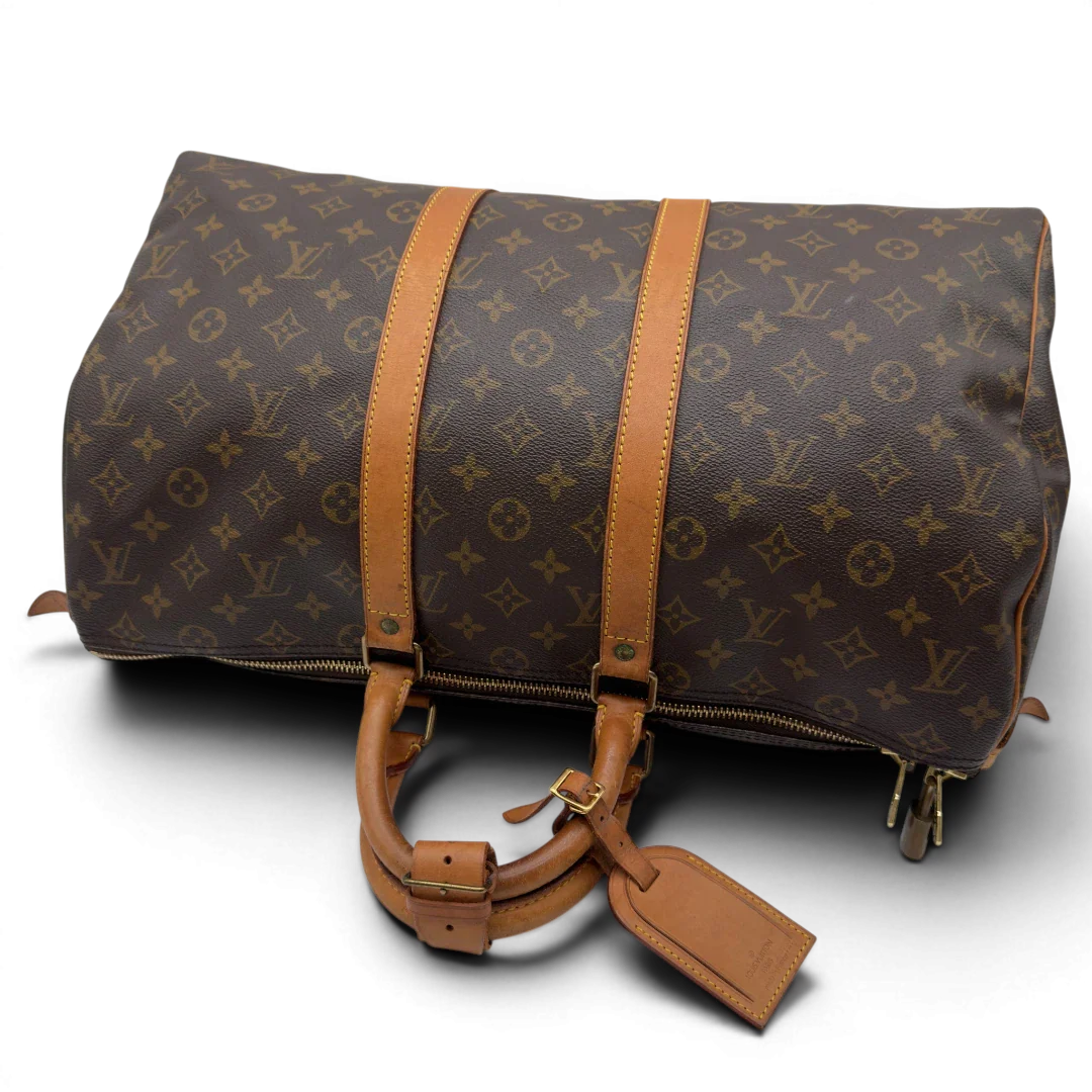 https://cdn.shopify.com/s/files/1/0564/9376/8855/files/Louis_Vuitton_Reisetasche_Keepall_45_monogram_braun_vintage_LV8388.webp?v=1780488245