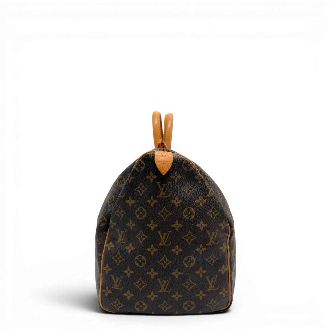 https://cdn.shopify.com/s/files/1/0564/9376/8855/files/Louis_Vuitton_Reisetasche_Keepall_50_monogram_braun_vintage_LV7740.webp?v=1779405988