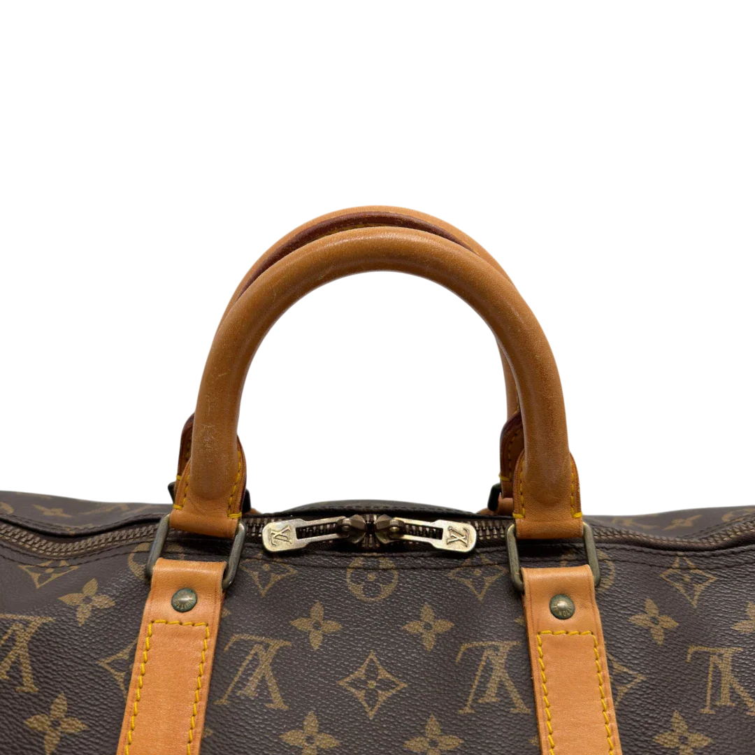 https://cdn.shopify.com/s/files/1/0564/9376/8855/files/Louis_Vuitton_Reisetasche_Keepall_50_monogram_braun_vintage_LV7748.webp?v=1779405988