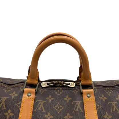 https://cdn.shopify.com/s/files/1/0564/9376/8855/files/Louis_Vuitton_Reisetasche_Keepall_50_monogram_braun_vintage_LV7748.webp?v=1779405988