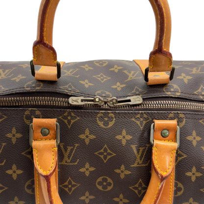 https://cdn.shopify.com/s/files/1/0564/9376/8855/files/Louis_Vuitton_Reisetasche_Keepall_50_monogram_braun_vintage_LV7752.webp?v=1779405988