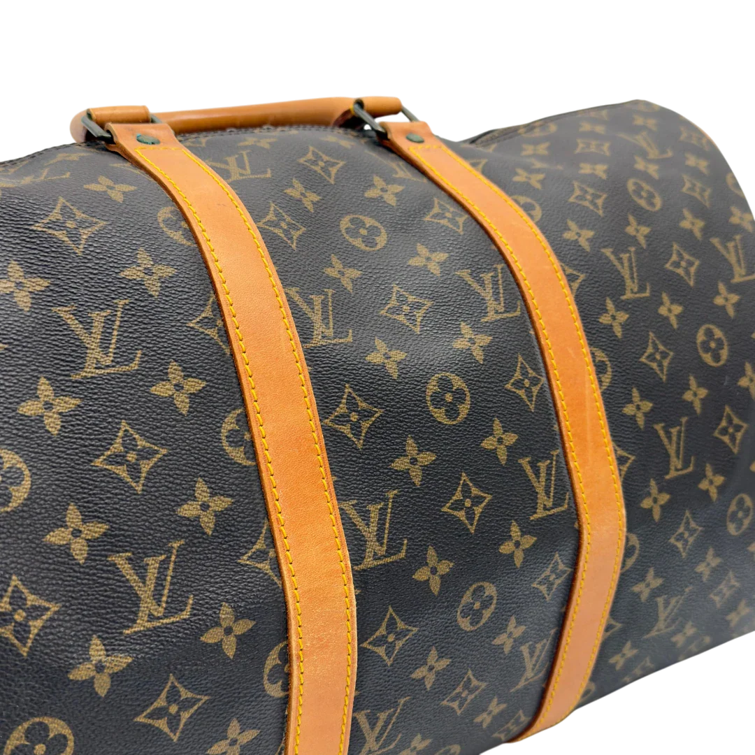 https://cdn.shopify.com/s/files/1/0564/9376/8855/files/Louis_Vuitton_Reisetasche_Keepall_50_monogram_braun_vintage_LV7754.webp?v=1779405988