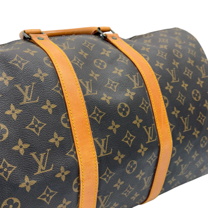 https://cdn.shopify.com/s/files/1/0564/9376/8855/files/Louis_Vuitton_Reisetasche_Keepall_50_monogram_braun_vintage_LV7754.webp?v=1779405988