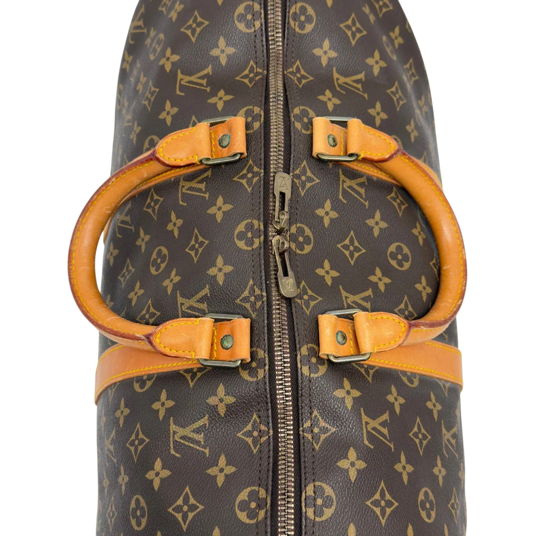 https://cdn.shopify.com/s/files/1/0564/9376/8855/files/Louis_Vuitton_Reisetasche_Keepall_50_monogram_braun_vintage_LV7755.webp?v=1779405988