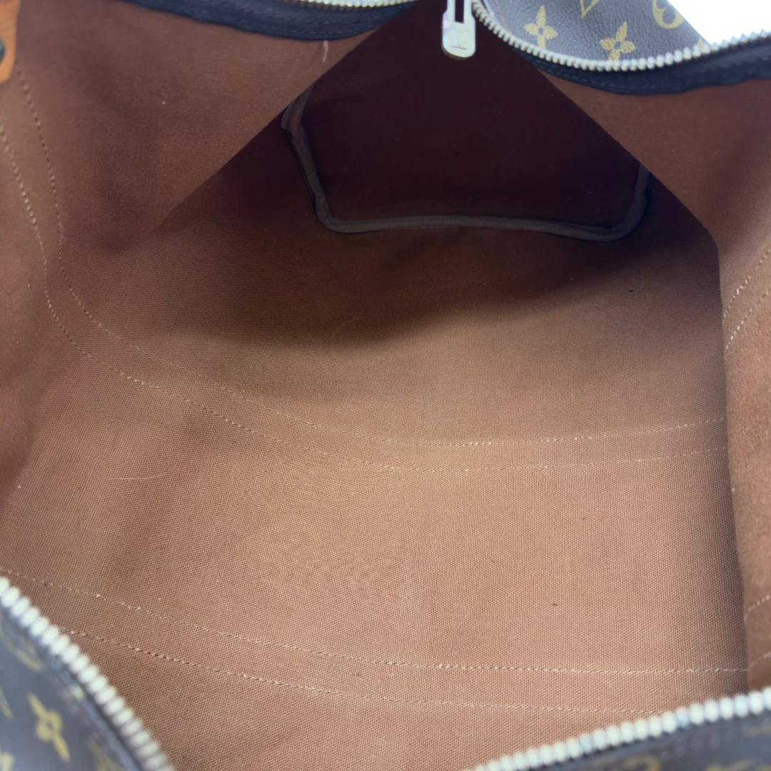 https://cdn.shopify.com/s/files/1/0564/9376/8855/files/Louis_Vuitton_Reisetasche_Keepall_50_monogram_braun_vintage_LV7758.webp?v=1779405989