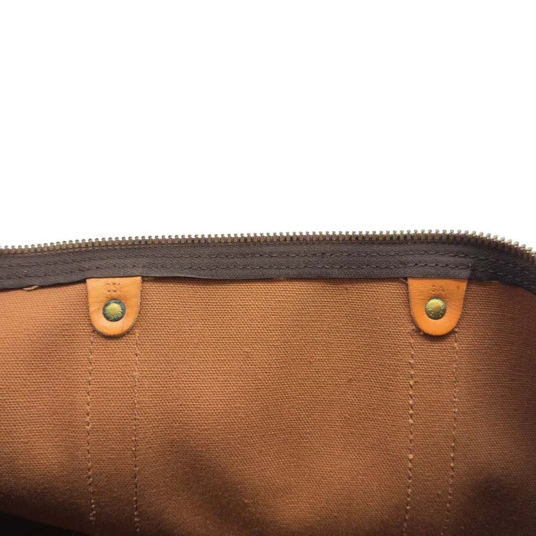 https://cdn.shopify.com/s/files/1/0564/9376/8855/files/Louis_Vuitton_Reisetasche_Keepall_50_monogram_braun_vintage_LV7761.webp?v=1779405988