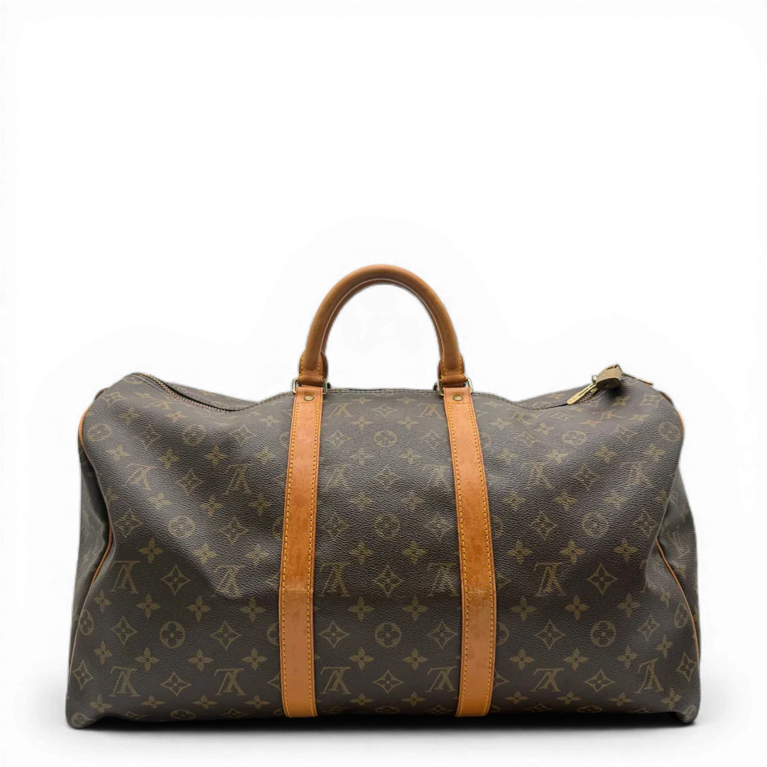 https://cdn.shopify.com/s/files/1/0564/9376/8855/files/Louis_Vuitton_Reisetasche_Keepall_50_monogram_braun_vintage_LV_1424.webp?v=1772710314