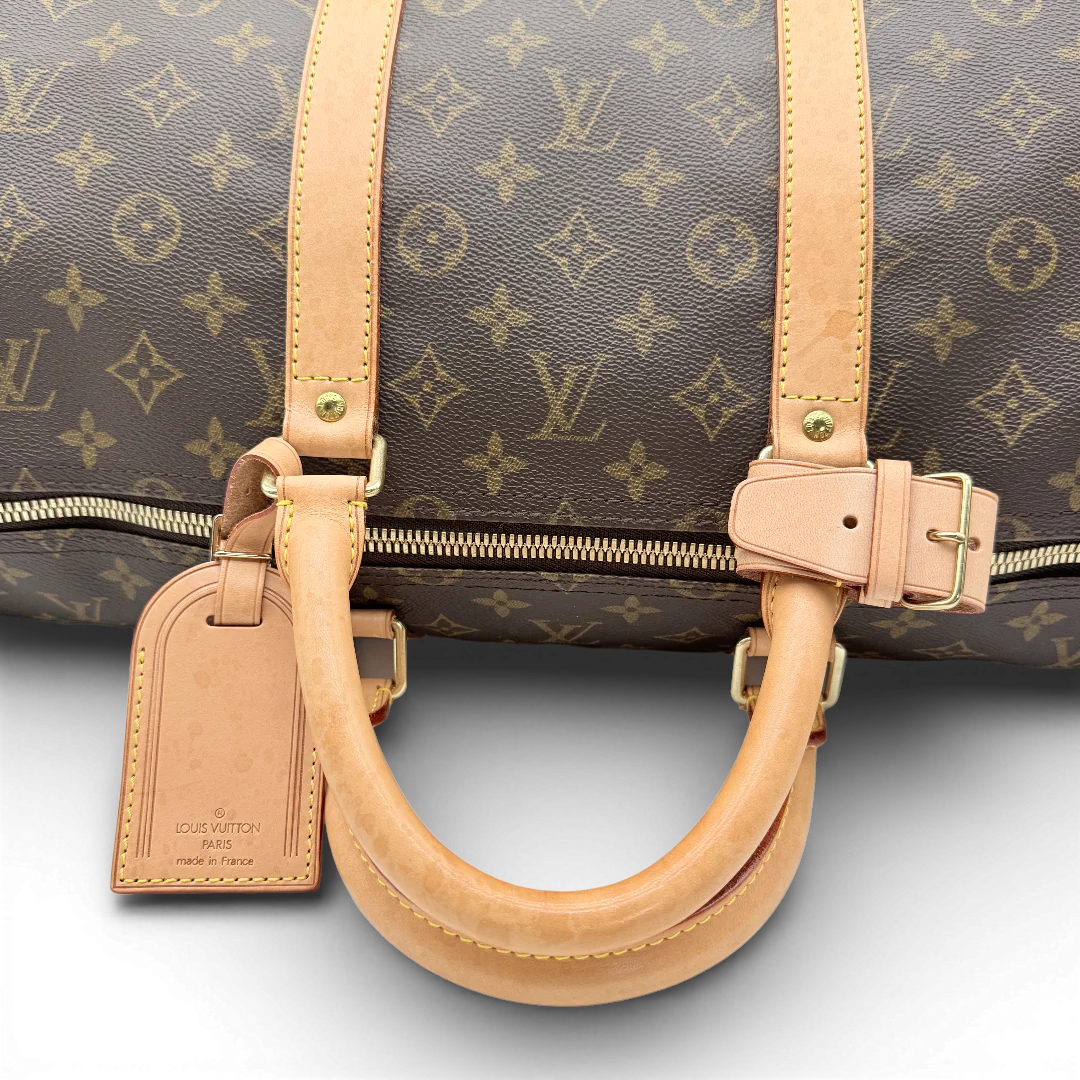 https://cdn.shopify.com/s/files/1/0564/9376/8855/files/Louis_Vuitton_Reisetasche_Keepall_55_monogram_braun_vintage_LV_1032.webp?v=1770890836