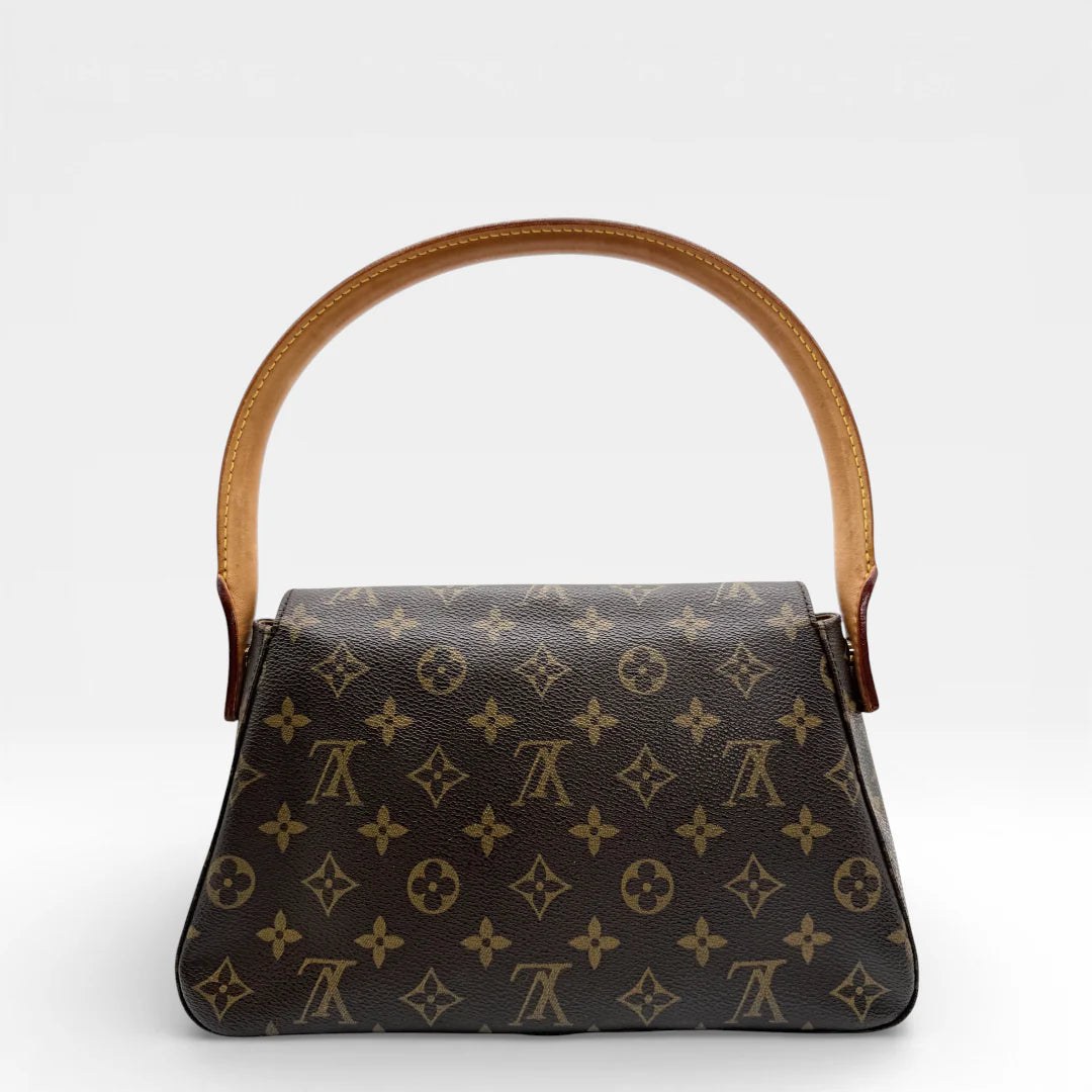 https://cdn.shopify.com/s/files/1/0564/9376/8855/files/Louis_Vuitton_Schultertasche_Mini_Looping_monogram_braun_vintage_LV_8564.webp?v=1768480173