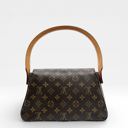 https://cdn.shopify.com/s/files/1/0564/9376/8855/files/Louis_Vuitton_Schultertasche_Mini_Looping_monogram_braun_vintage_LV_8564.webp?v=1768480173