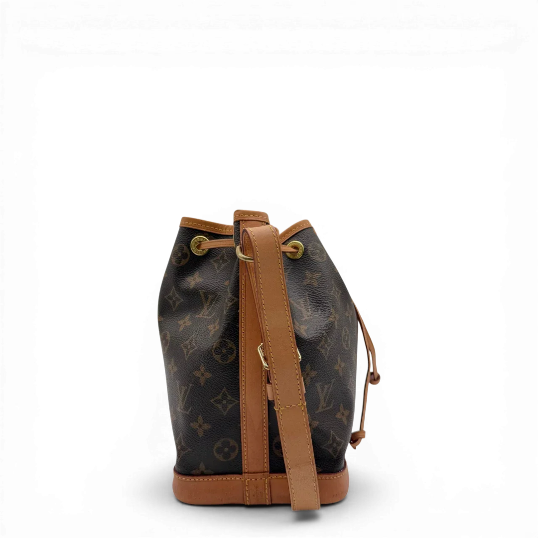 https://cdn.shopify.com/s/files/1/0564/9376/8855/files/Louis_Vuitton_Schultertasche_Sac_Noe_BB_monogram_braun_vintage_LV3565.webp?v=1774402757