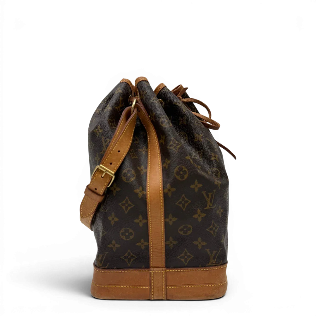 https://cdn.shopify.com/s/files/1/0564/9376/8855/files/Louis_Vuitton_Schultertasche_Sac_Noe_Grande_monogram_braun_vintage_LV7655.webp?v=1780488071