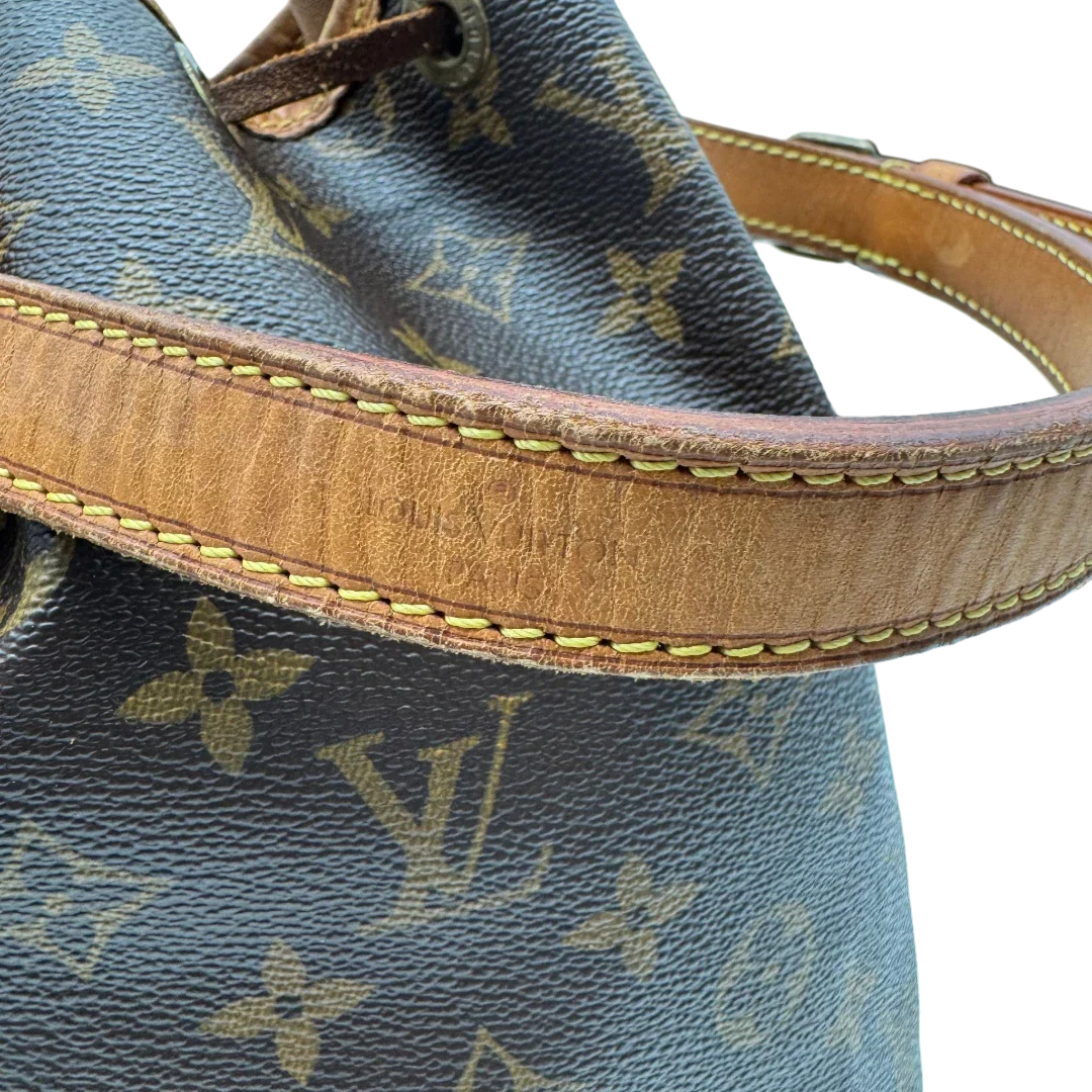 https://cdn.shopify.com/s/files/1/0564/9376/8855/files/Louis_Vuitton_Schultertasche_Sac_Noe_grande_monogram_braun_vintage_LV2183.webp?v=1779963003