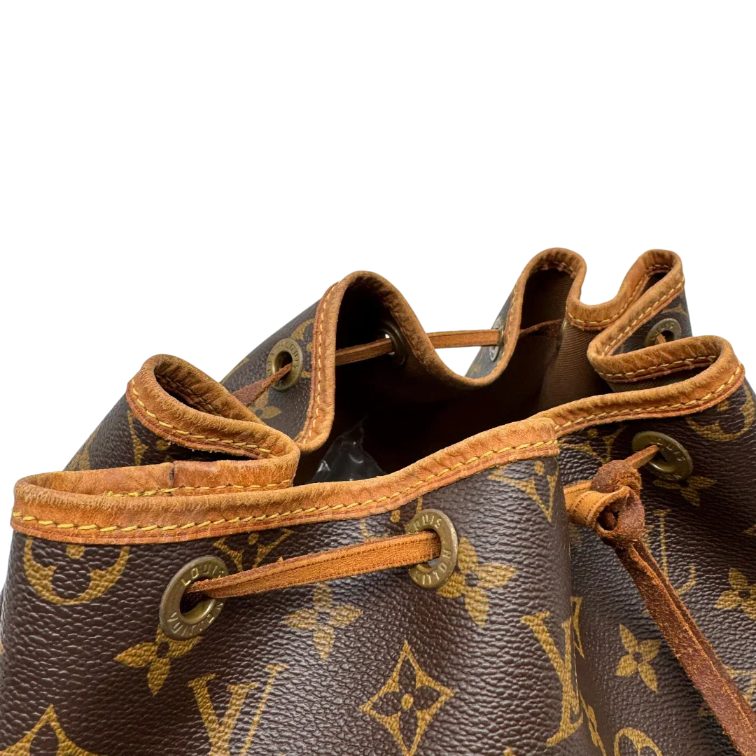 https://cdn.shopify.com/s/files/1/0564/9376/8855/files/Louis_Vuitton_Schultertasche_Sac_Noe_grande_monogram_braun_vintage_LV2189.webp?v=1779963003