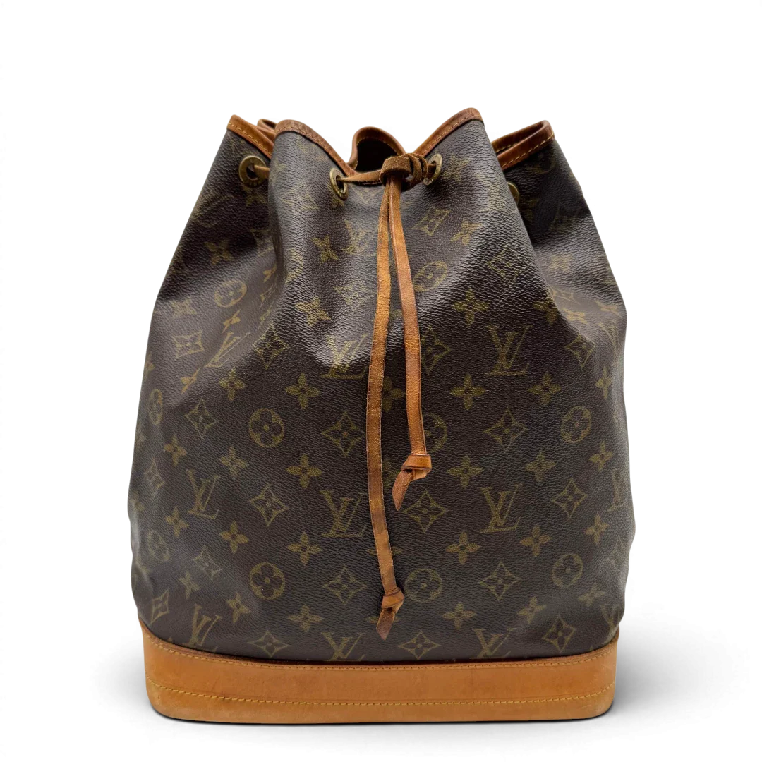 https://cdn.shopify.com/s/files/1/0564/9376/8855/files/Louis_Vuitton_Schultertasche_Sac_Noe_grande_monogram_braun_vintage_LV2193.webp?v=1779962922