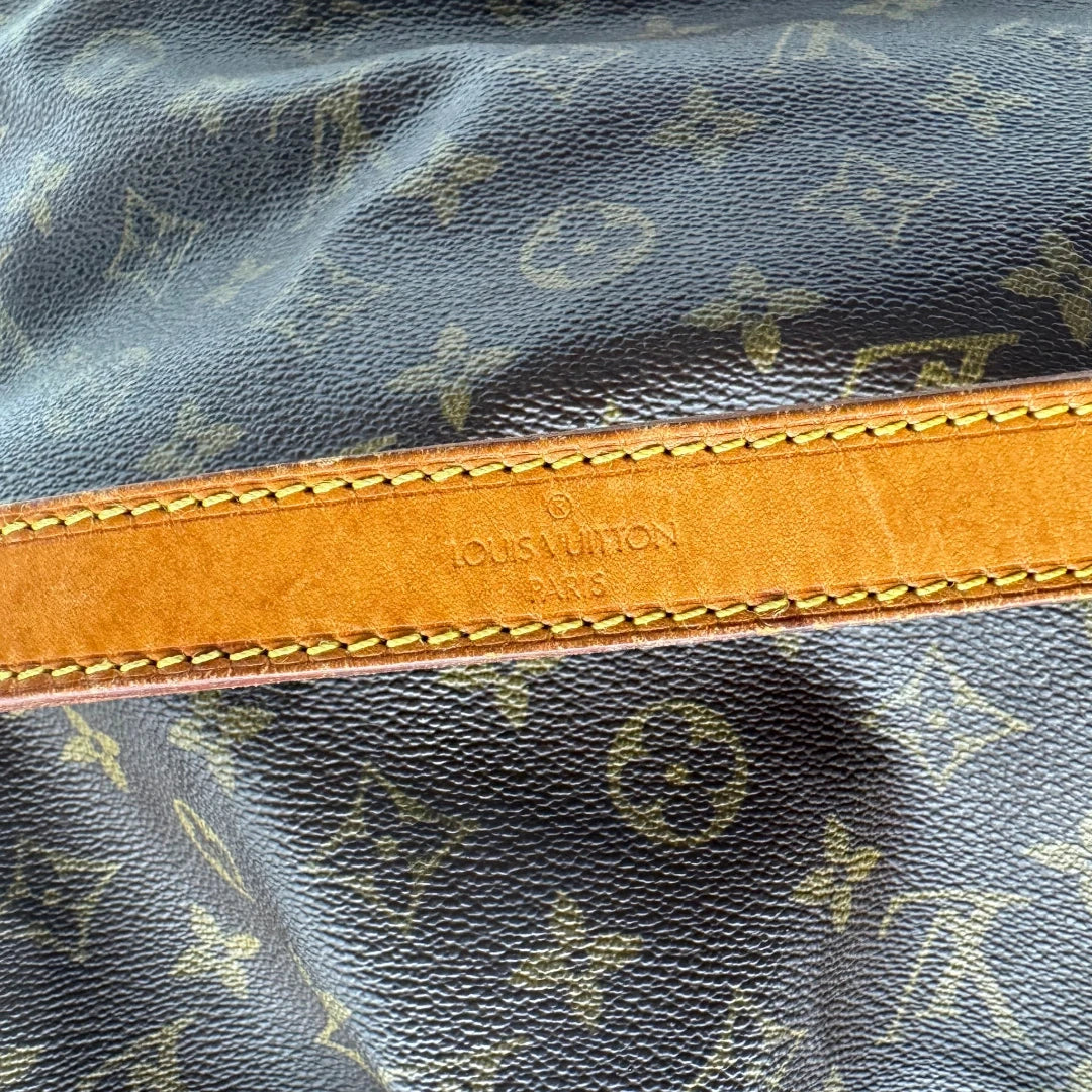 https://cdn.shopify.com/s/files/1/0564/9376/8855/files/Louis_Vuitton_Schultertasche_Sac_Noe_grande_monogram_braun_vintage_LV2206.webp?v=1779962922