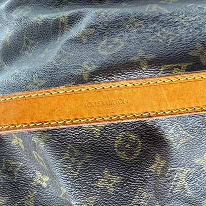 https://cdn.shopify.com/s/files/1/0564/9376/8855/files/Louis_Vuitton_Schultertasche_Sac_Noe_grande_monogram_braun_vintage_LV2206.webp?v=1779962922