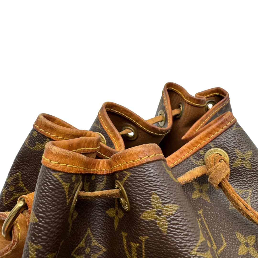 https://cdn.shopify.com/s/files/1/0564/9376/8855/files/Louis_Vuitton_Schultertasche_Sac_Noe_grande_monogram_braun_vintage_LV2212.webp?v=1779962922