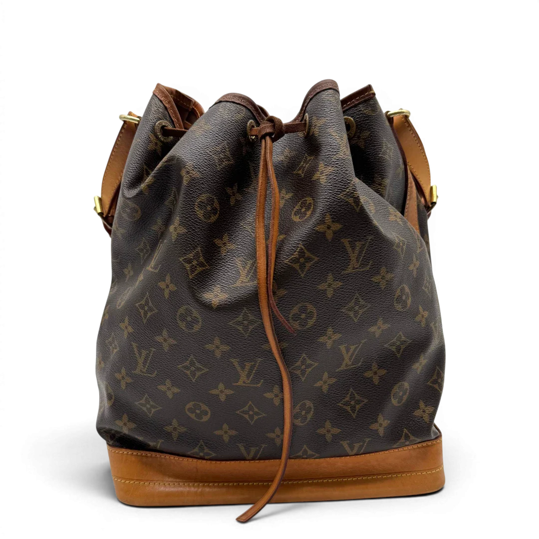 https://cdn.shopify.com/s/files/1/0564/9376/8855/files/Louis_Vuitton_Schultertasche_Sac_Noe_grande_monogram_braun_vintage_LV2216.webp?v=1779963099