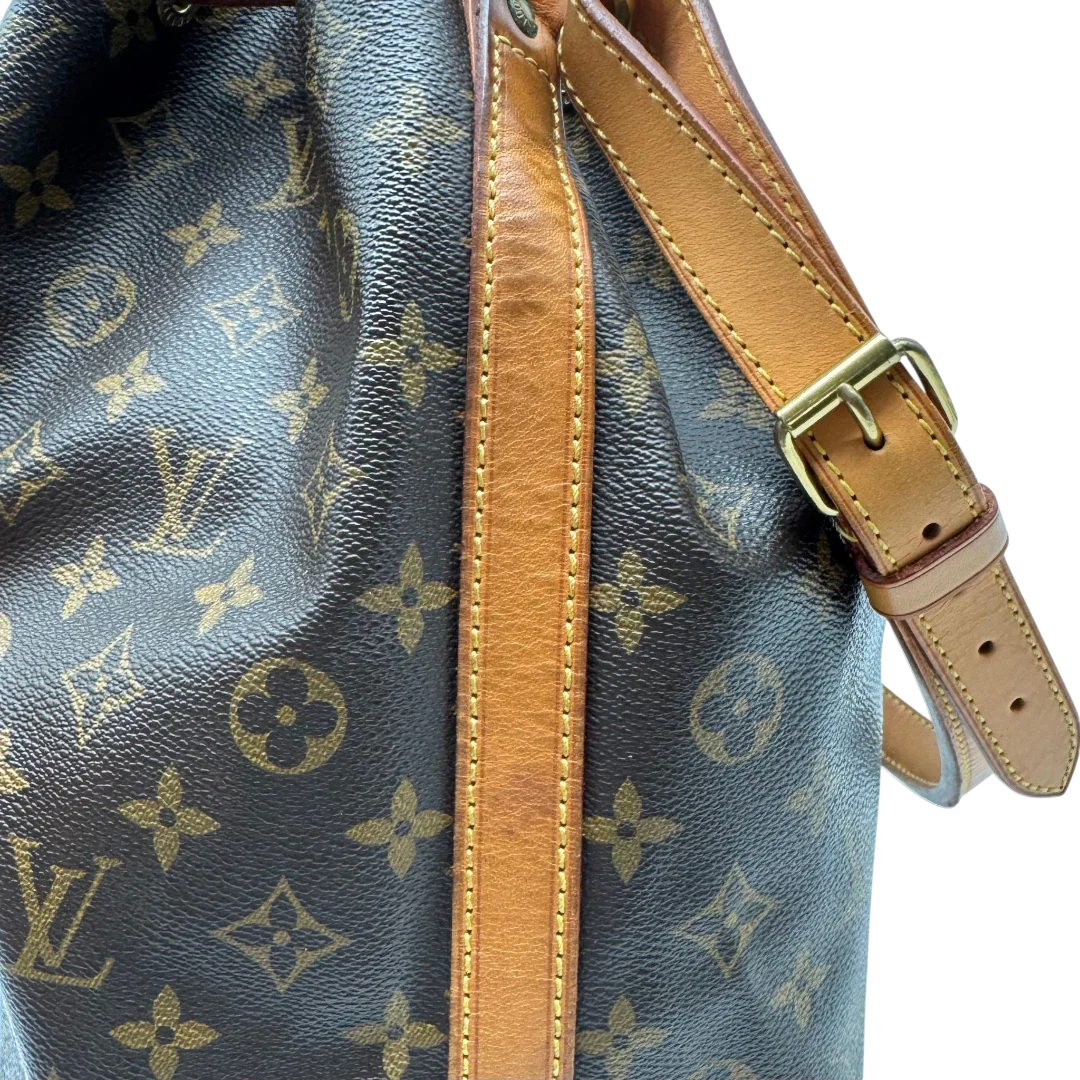 https://cdn.shopify.com/s/files/1/0564/9376/8855/files/Louis_Vuitton_Schultertasche_Sac_Noe_grande_monogram_braun_vintage_LV2234.webp?v=1779963099