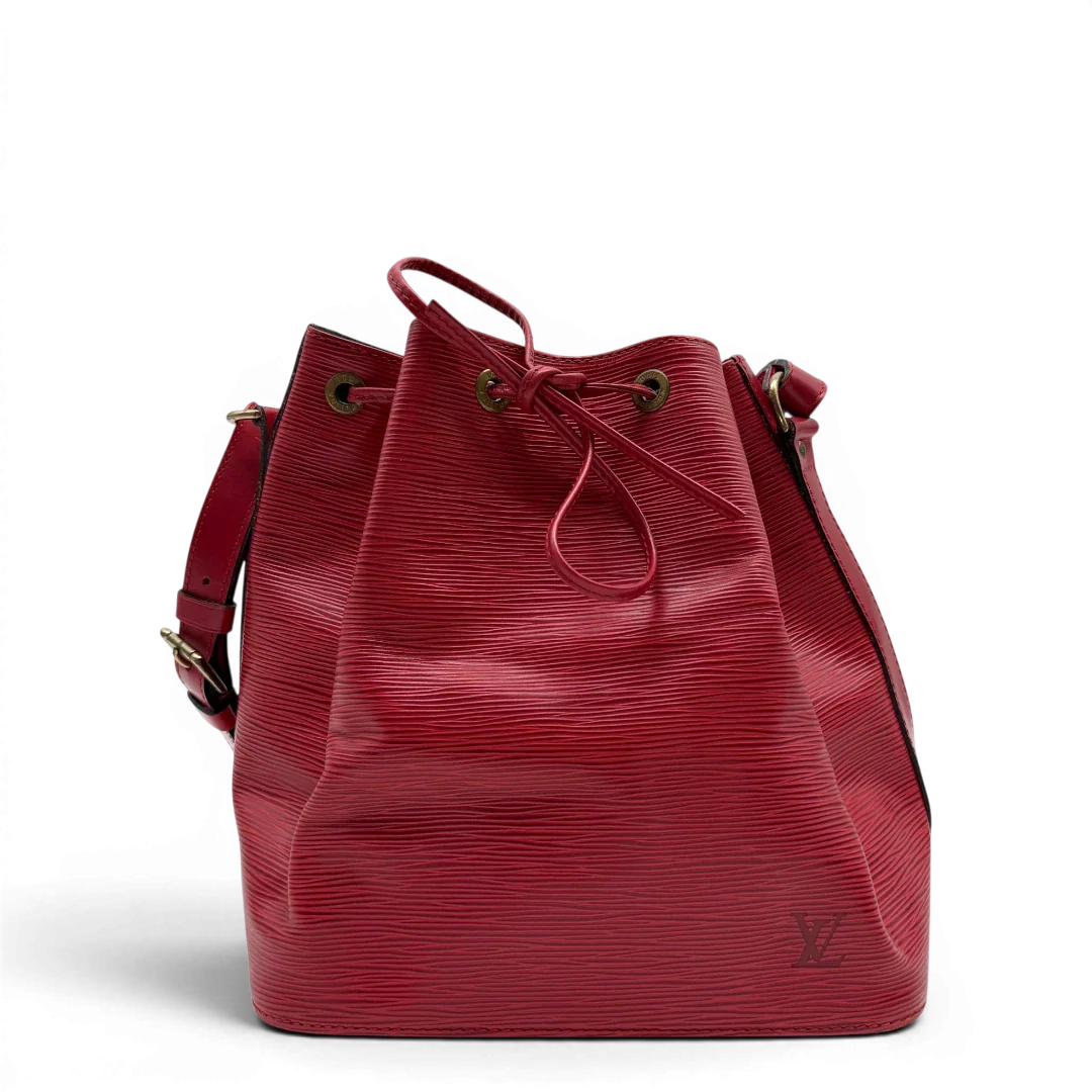 https://cdn.shopify.com/s/files/1/0564/9376/8855/files/Louis_Vuitton_Schultertasche_Sac_Noe_petit_Epi_aus_Leder_rot_vintage_LV6513.webp?v=1778681400