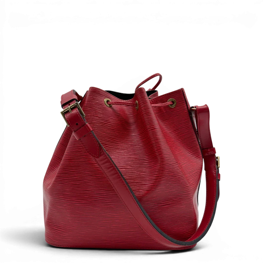 https://cdn.shopify.com/s/files/1/0564/9376/8855/files/Louis_Vuitton_Schultertasche_Sac_Noe_petit_Epi_aus_Leder_rot_vintage_LV6514.webp?v=1778681400