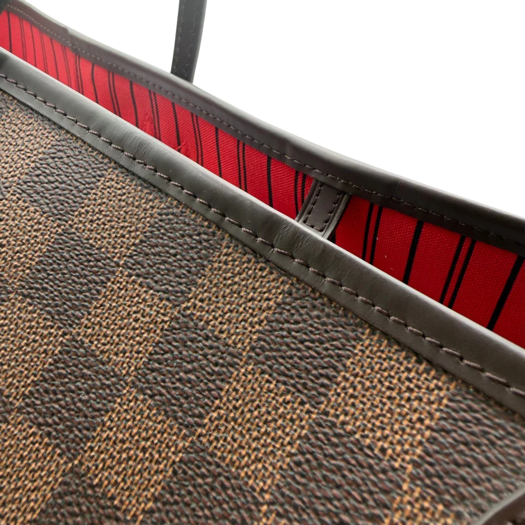 https://cdn.shopify.com/s/files/1/0564/9376/8855/files/Louis_Vuitton_Shopper_Neverfull_GM_Damier_Ebene_braun_12.webp?v=1781773038
