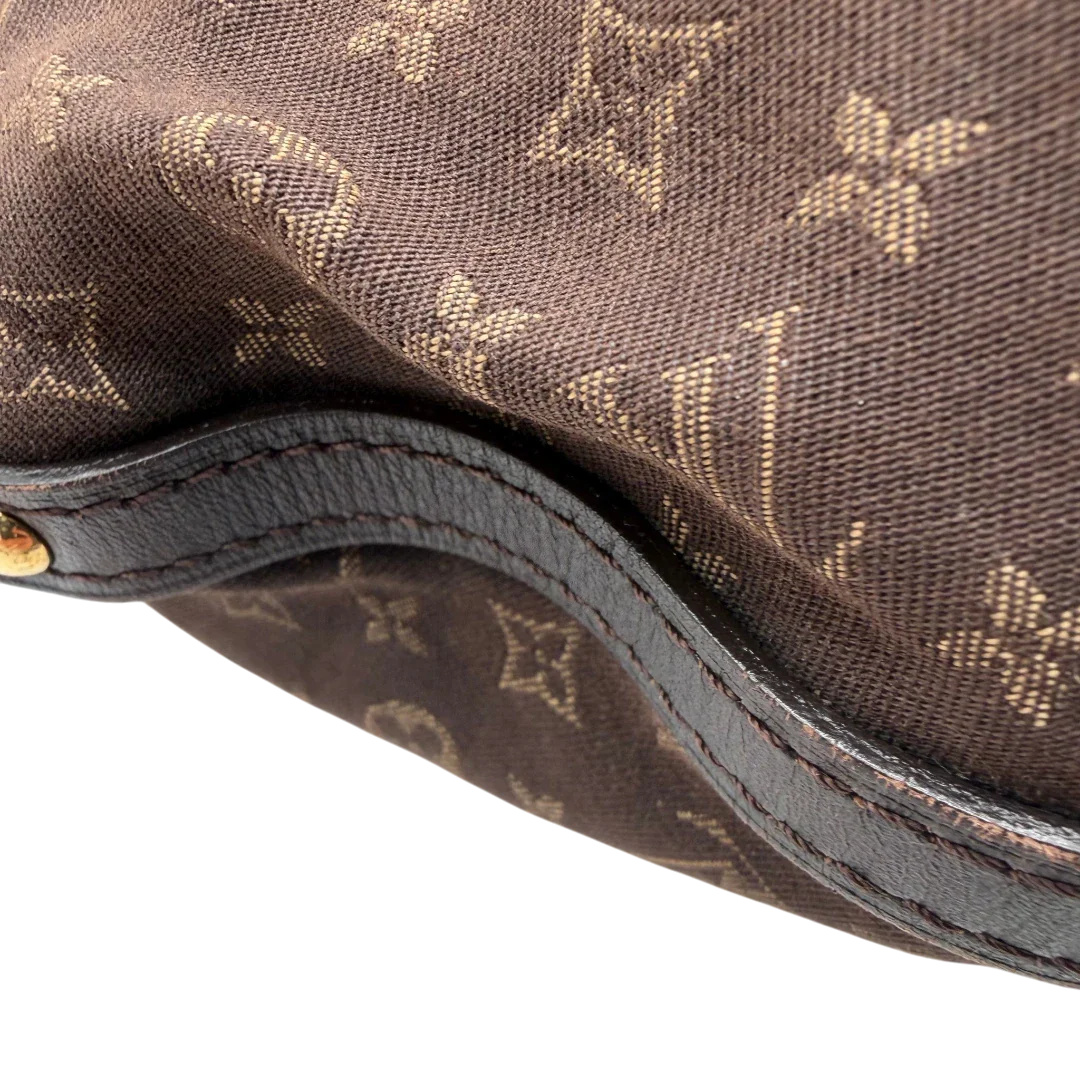 https://cdn.shopify.com/s/files/1/0564/9376/8855/files/Louis_Vuitton_Umhangetasche_Rhapsody_MM_aus_Denimstoff_braun_vintage_LV7428.webp?v=1779964089