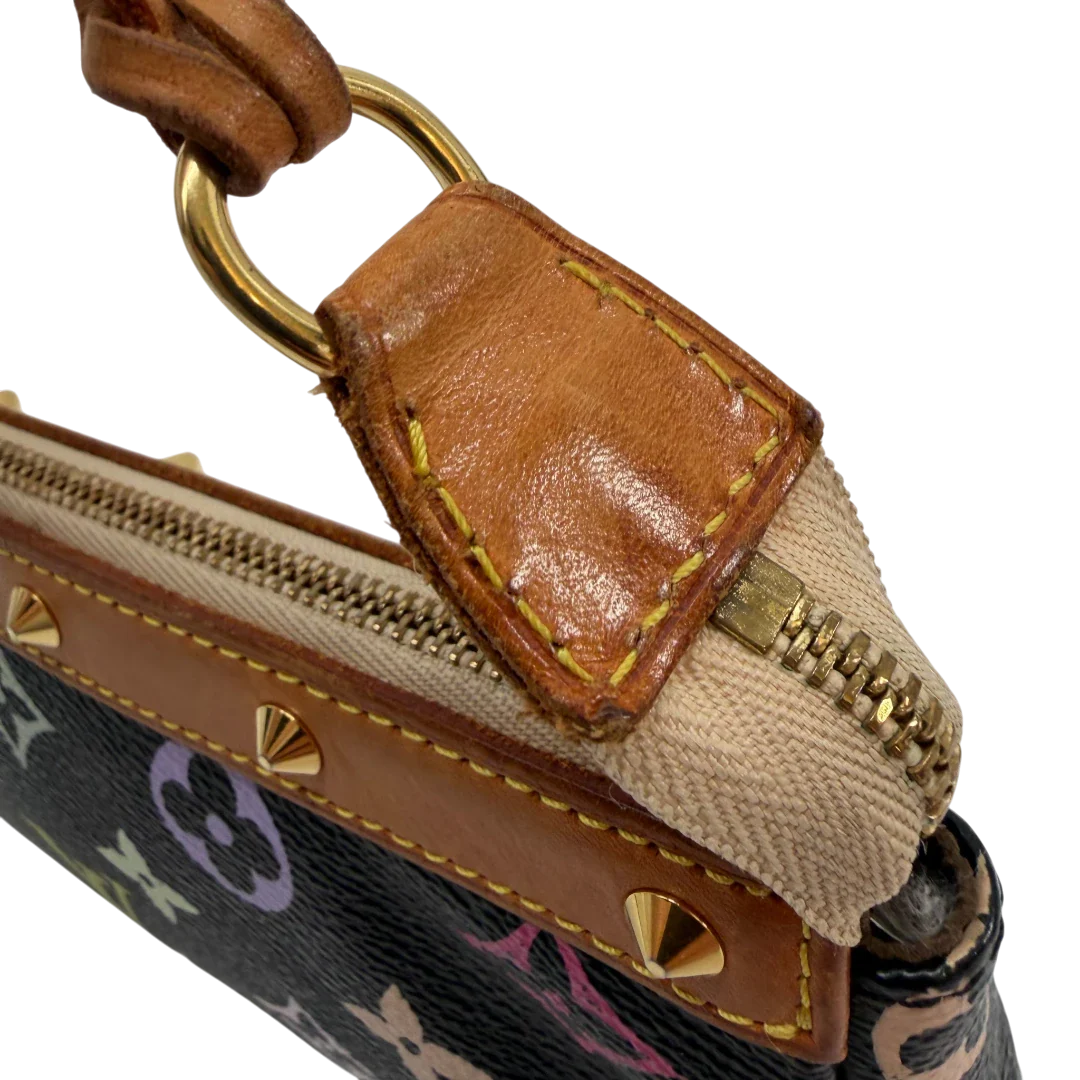 https://cdn.shopify.com/s/files/1/0564/9376/8855/files/Louis_Vuitton_x_Murakami_Pochette_Accessoires_monogram_schwarz_vintage_LV6890.webp?v=1779321151