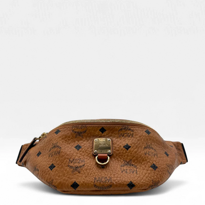 https://cdn.shopify.com/s/files/1/0564/9376/8855/files/MCM_Bauchtasche_Fursten_small_visetos_braun_second_hand_luxury_MCM_Fannypack7822.webp?v=1756984039