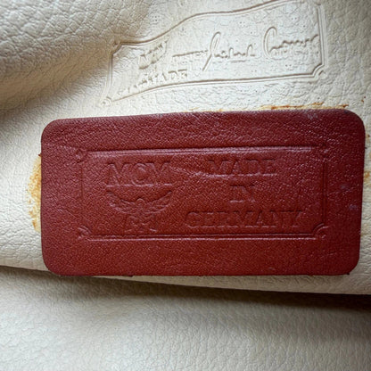 https://cdn.shopify.com/s/files/1/0564/9376/8855/files/MCM_Clutch_mittelgross_vintage5610.webp?v=1777481268