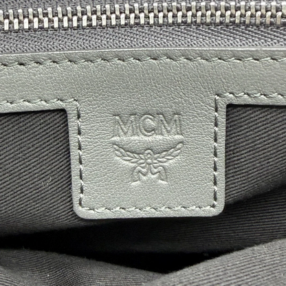 https://cdn.shopify.com/s/files/1/0564/9376/8855/files/MCM_Clutch_visetos_grau_vintage8466.webp?v=1781108551