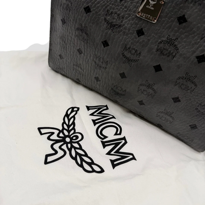 https://cdn.shopify.com/s/files/1/0564/9376/8855/files/MCM_Clutch_visetos_grau_vintage8468.webp?v=1781108550