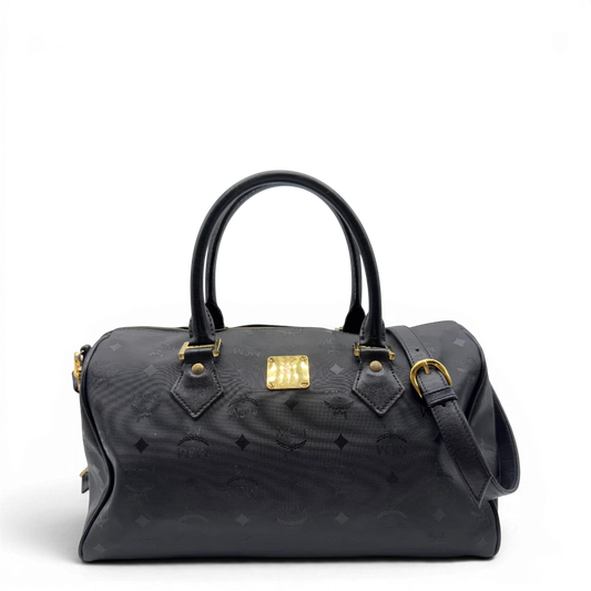 https://cdn.shopify.com/s/files/1/0564/9376/8855/files/MCM_Handtasche_Boston_35_vintage_mit_Umhangegurt_aus_PVC_schwarz_vintage7911.webp?v=1779969405