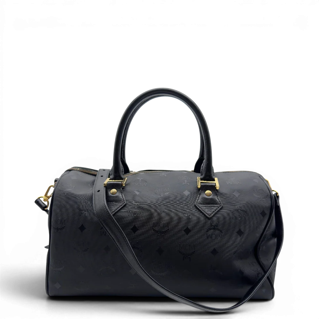 https://cdn.shopify.com/s/files/1/0564/9376/8855/files/MCM_Handtasche_Boston_35_vintage_mit_Umhangegurt_aus_PVC_schwarz_vintage7912.webp?v=1779969406