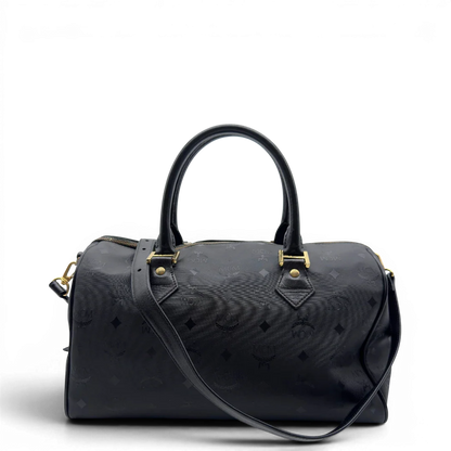 https://cdn.shopify.com/s/files/1/0564/9376/8855/files/MCM_Handtasche_Boston_35_vintage_mit_Umhangegurt_aus_PVC_schwarz_vintage7912.webp?v=1779969406