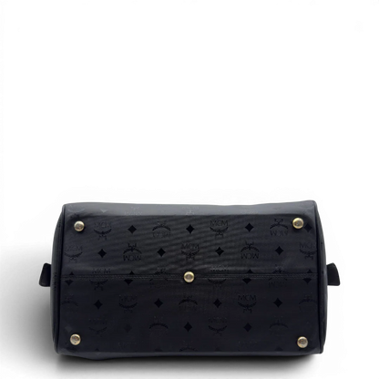 https://cdn.shopify.com/s/files/1/0564/9376/8855/files/MCM_Handtasche_Boston_35_vintage_mit_Umhangegurt_aus_PVC_schwarz_vintage7915.webp?v=1779969405