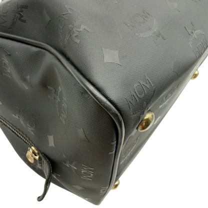 https://cdn.shopify.com/s/files/1/0564/9376/8855/files/MCM_Handtasche_Boston_35_vintage_mit_Umhangegurt_aus_PVC_schwarz_vintage7917.webp?v=1779969405