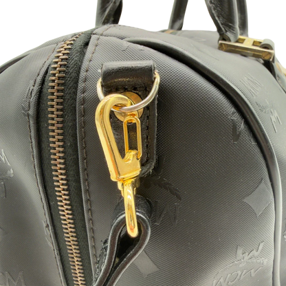 https://cdn.shopify.com/s/files/1/0564/9376/8855/files/MCM_Handtasche_Boston_35_vintage_mit_Umhangegurt_aus_PVC_schwarz_vintage7921.webp?v=1779969405